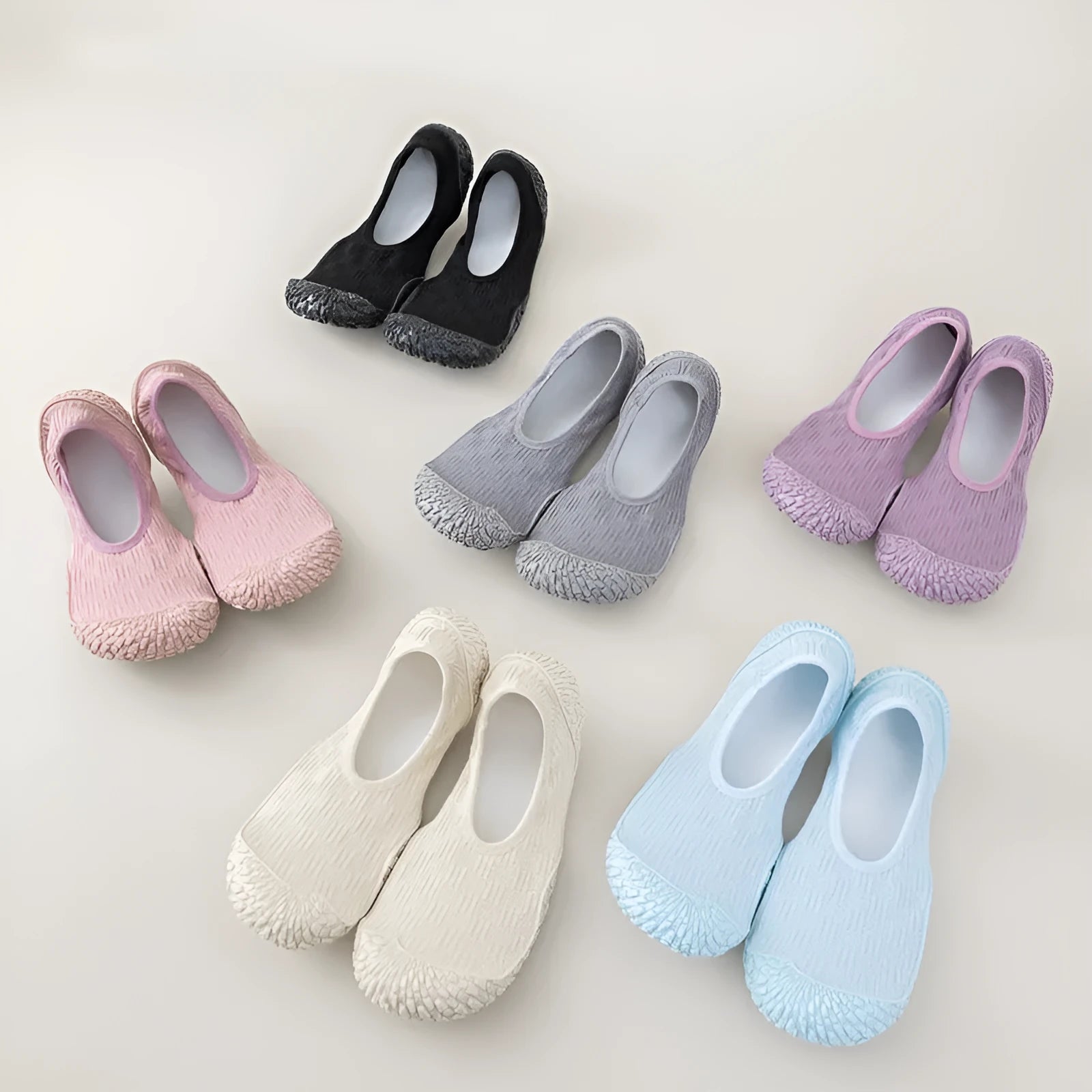 Women's indoor fitness shoe in solid colour with soft bottom, mesh upper, and rubber sole
