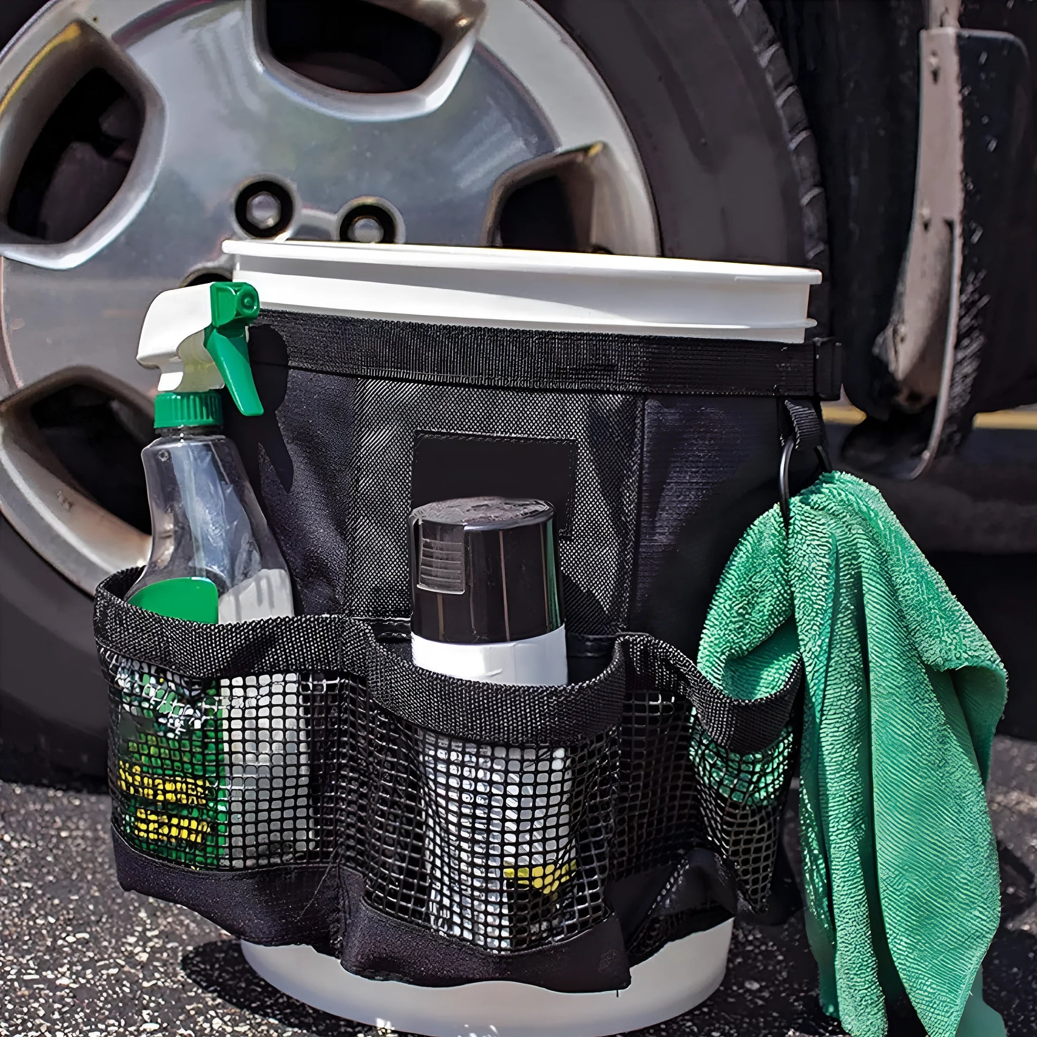 Black cylindrical polyester storage bag hanging on 5 gallon barrel with tools organised inside