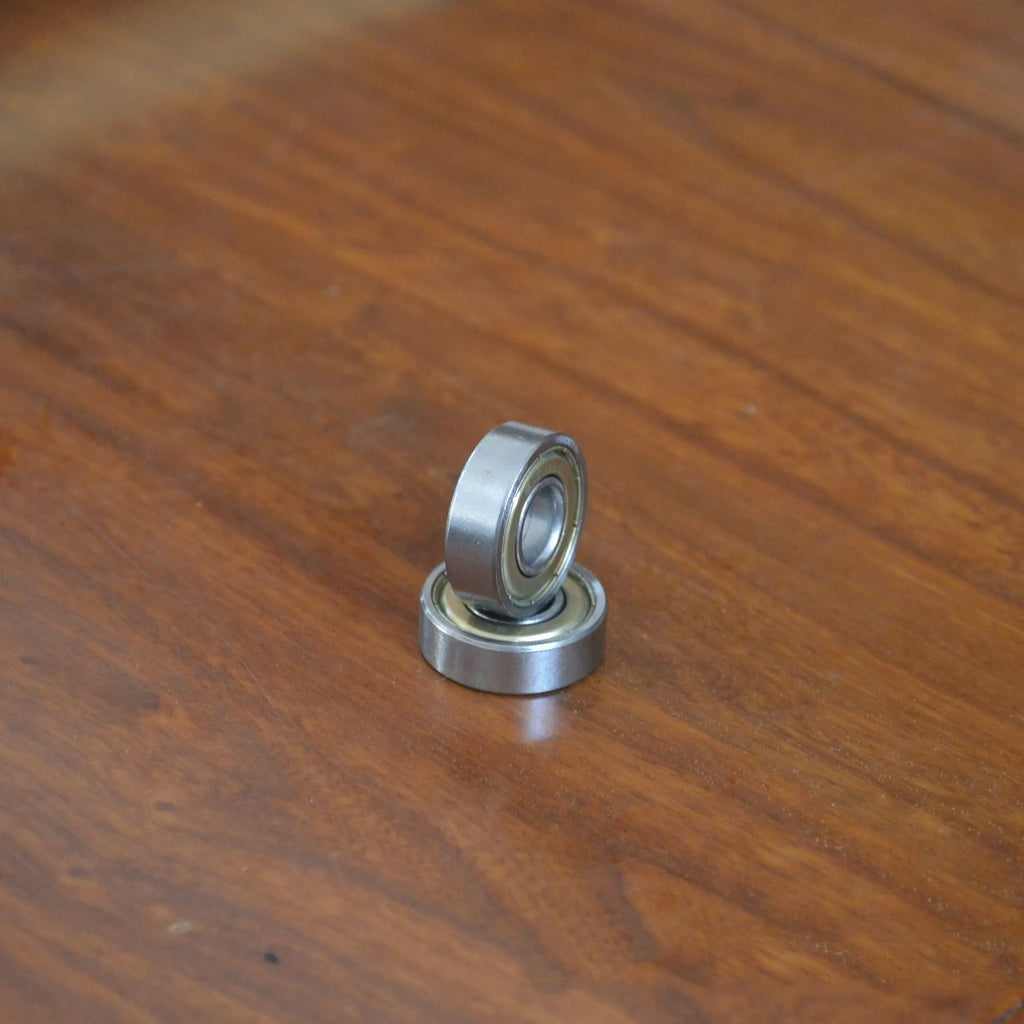 Carbon steel bearing 6000zz with dimensions 10x26x8mm on a white background