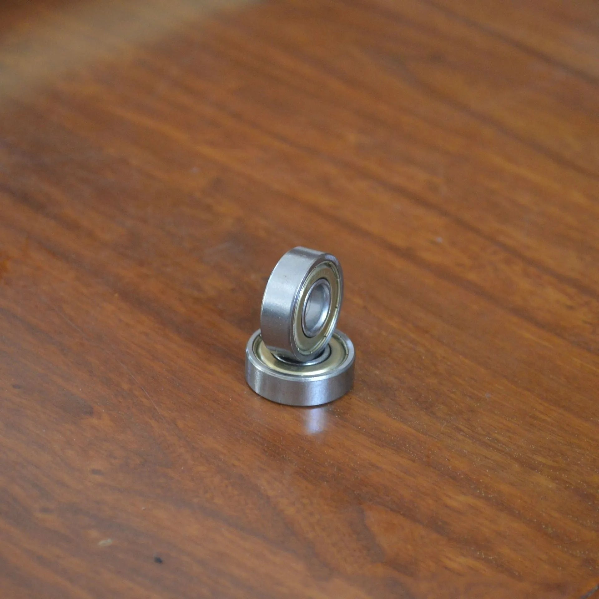 Carbon steel bearing 6000zz with dimensions 10x26x8mm on a white background