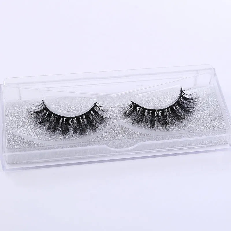 Handmade 3D mink full strip false eyelashes in style A01 against a white background