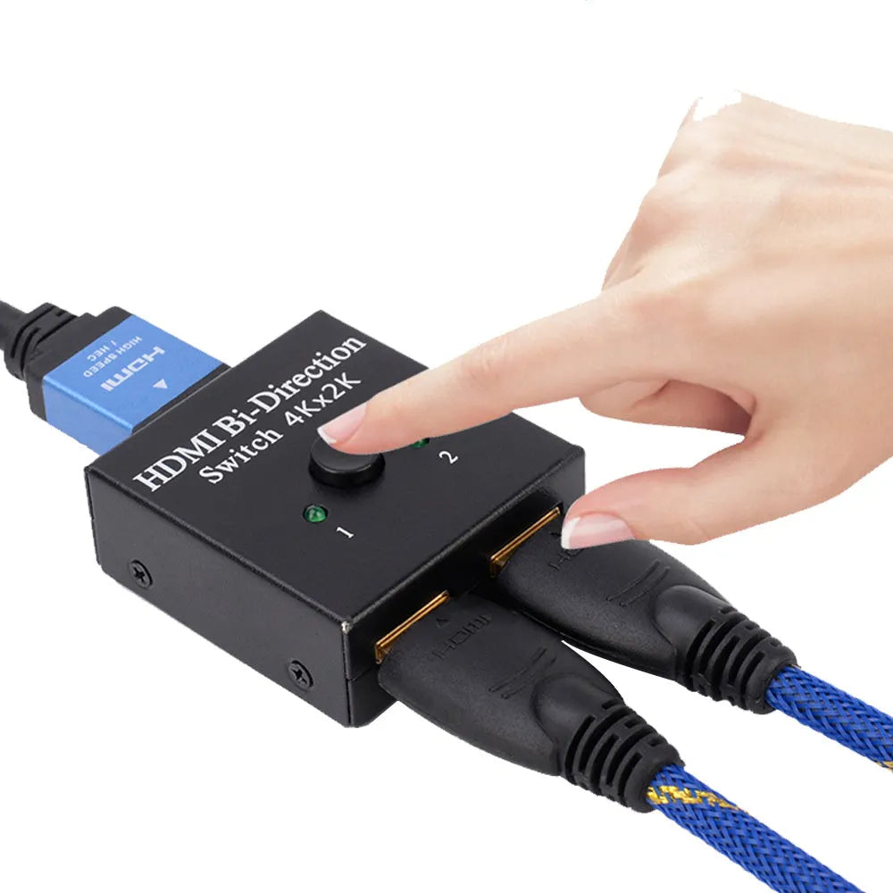 HDMI switcher 2 in 1 out in black plastic casing with two input ports and one output port