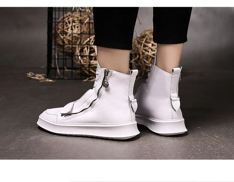 Man wearing black PU leather ankle boots in a high-top sneakers style for winter.