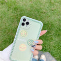 Green TPU iPhone back cover case with geometric smiley face and polka dot design.