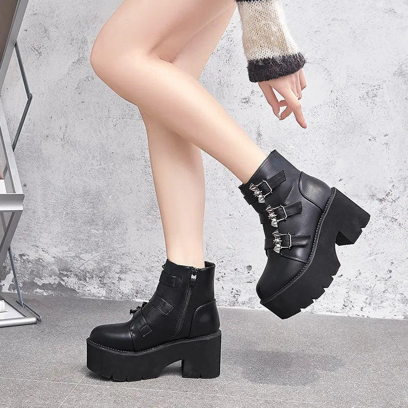 Black women's punk Martin boots with bat buckle, thick heel, and side zipper.