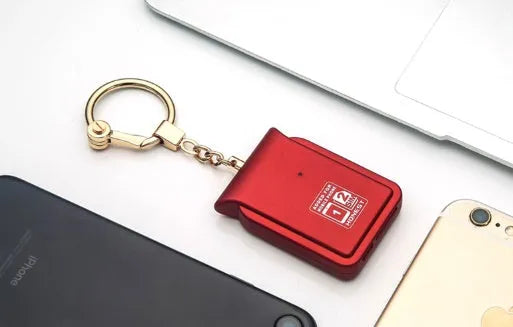Bluetooth dual SIM adapter keychain with Nano SIM slot and leather finish, compatible with iOS devices