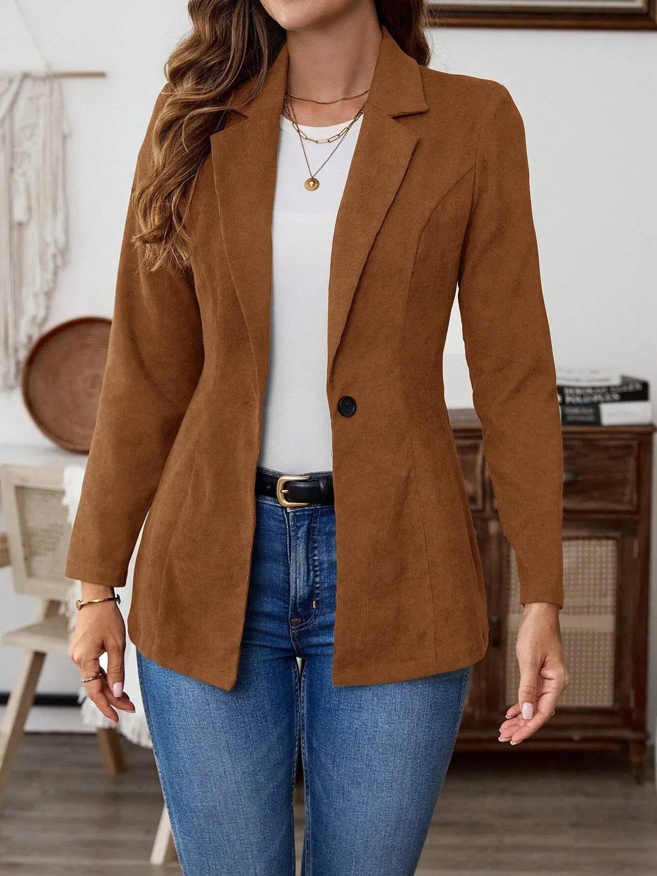 Brown men's single-breasted lapel collar coat with long sleeves on hanger