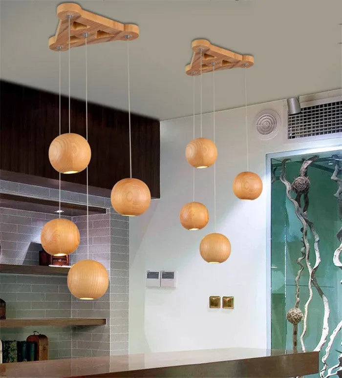 Nordic solid wood ball pendant chandelier with adjustable cord, shown in single and three-head style options.