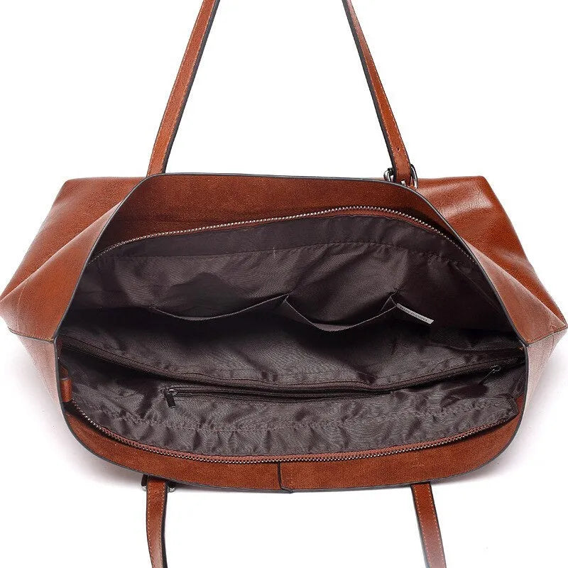 Brown waxed cowhide leather crossbody handbag shown horizontally, displaying two main compartments and a front phone pocket.