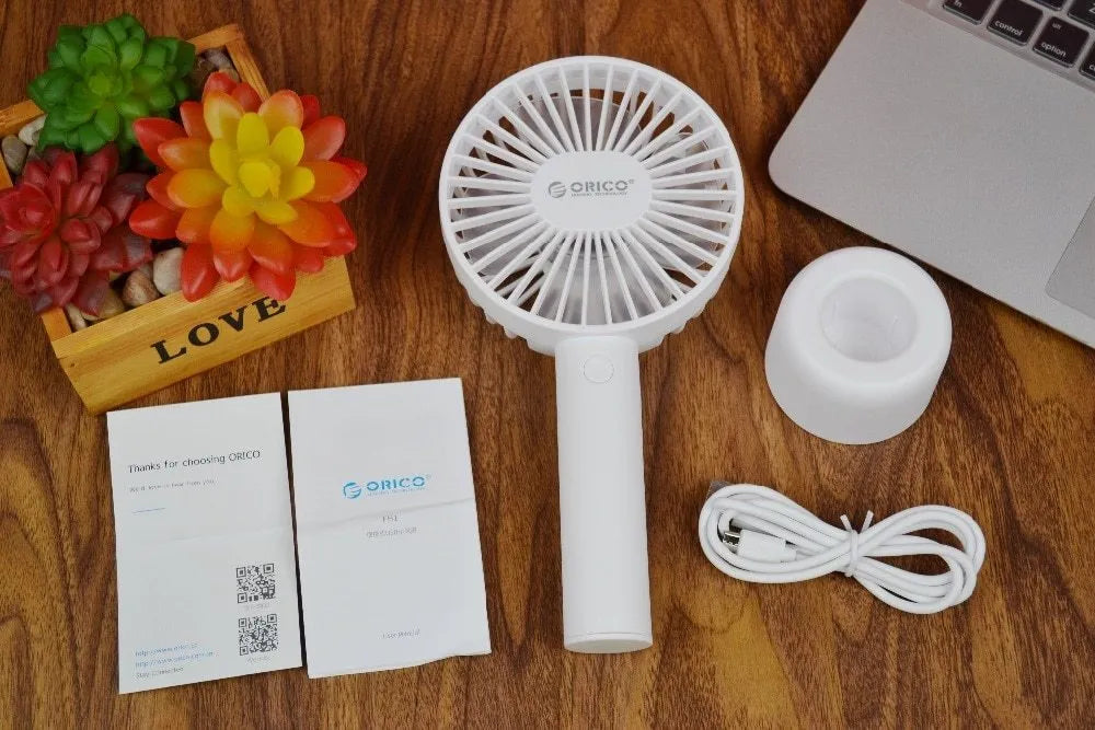 ORICO FH1 white portable USB desk fan with rechargeable battery shown on a desk