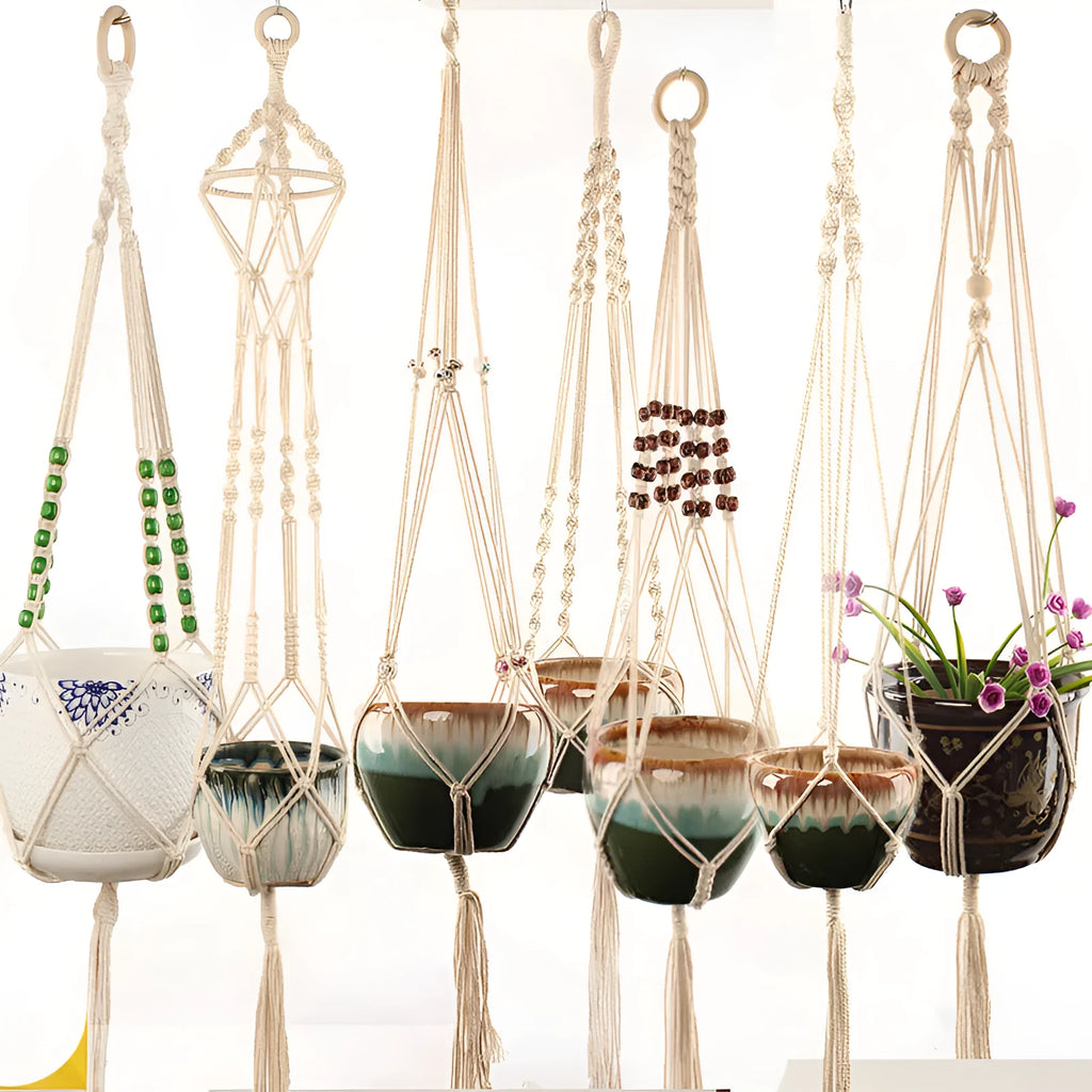 Woven cotton rope plant hanger in a hanging configuration holding a potted plant.