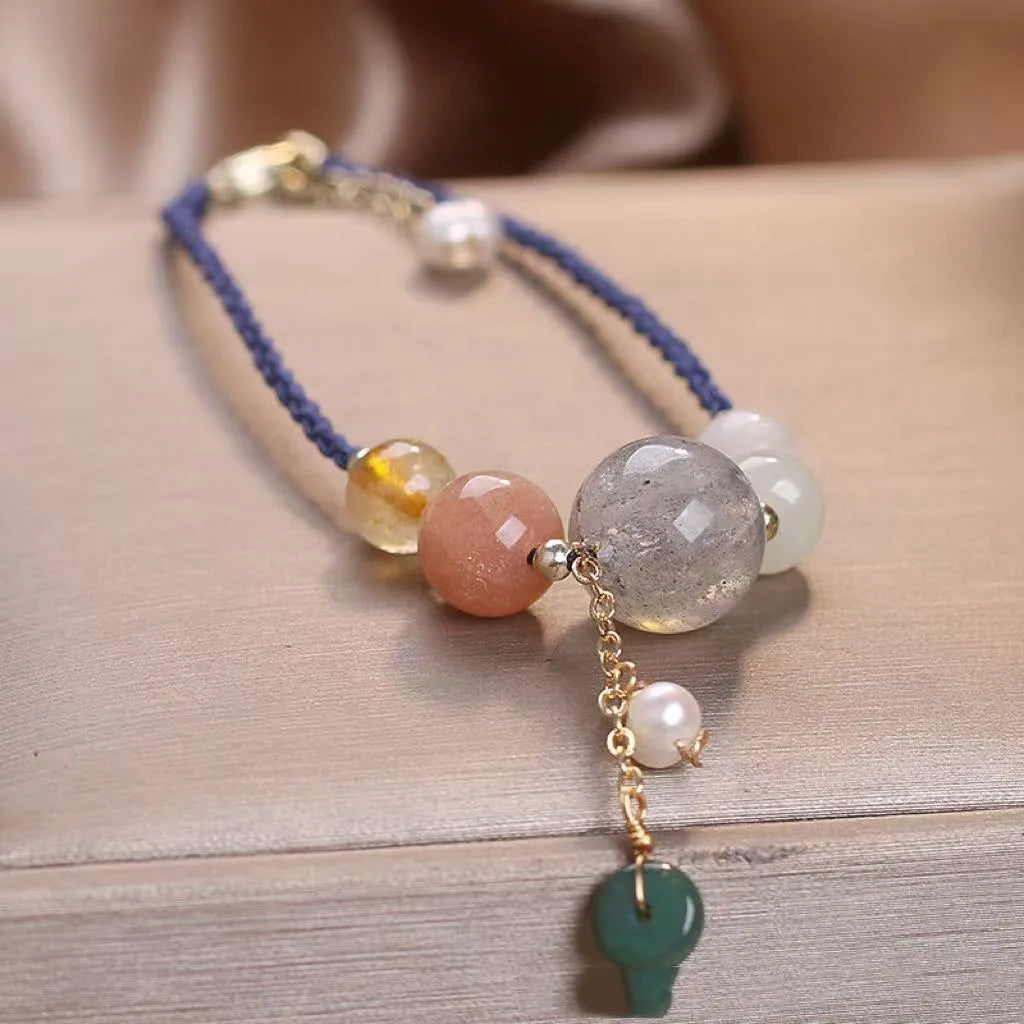 Hand-woven crystal peace buckle bracelet for women with sequins in red, green, and blue colours