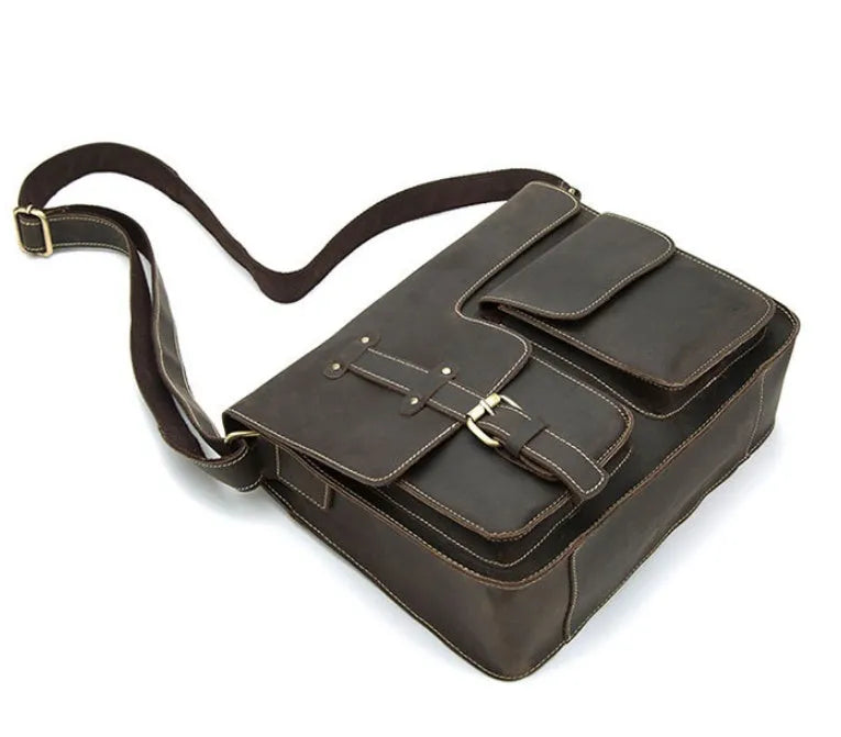 Vintage brown leather messenger bag with crossbody strap and front flap closure