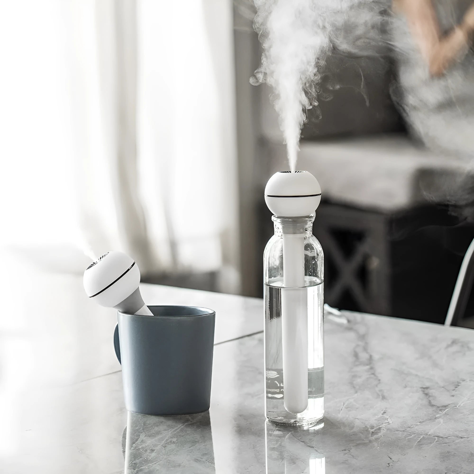 Columnar magic wand humidifier in pink or white with USB port and mechanical controls.