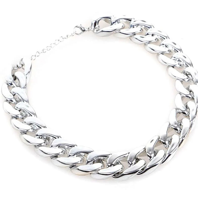 Adjustable geometric chain dog collar in gold or white for small to medium dogs.