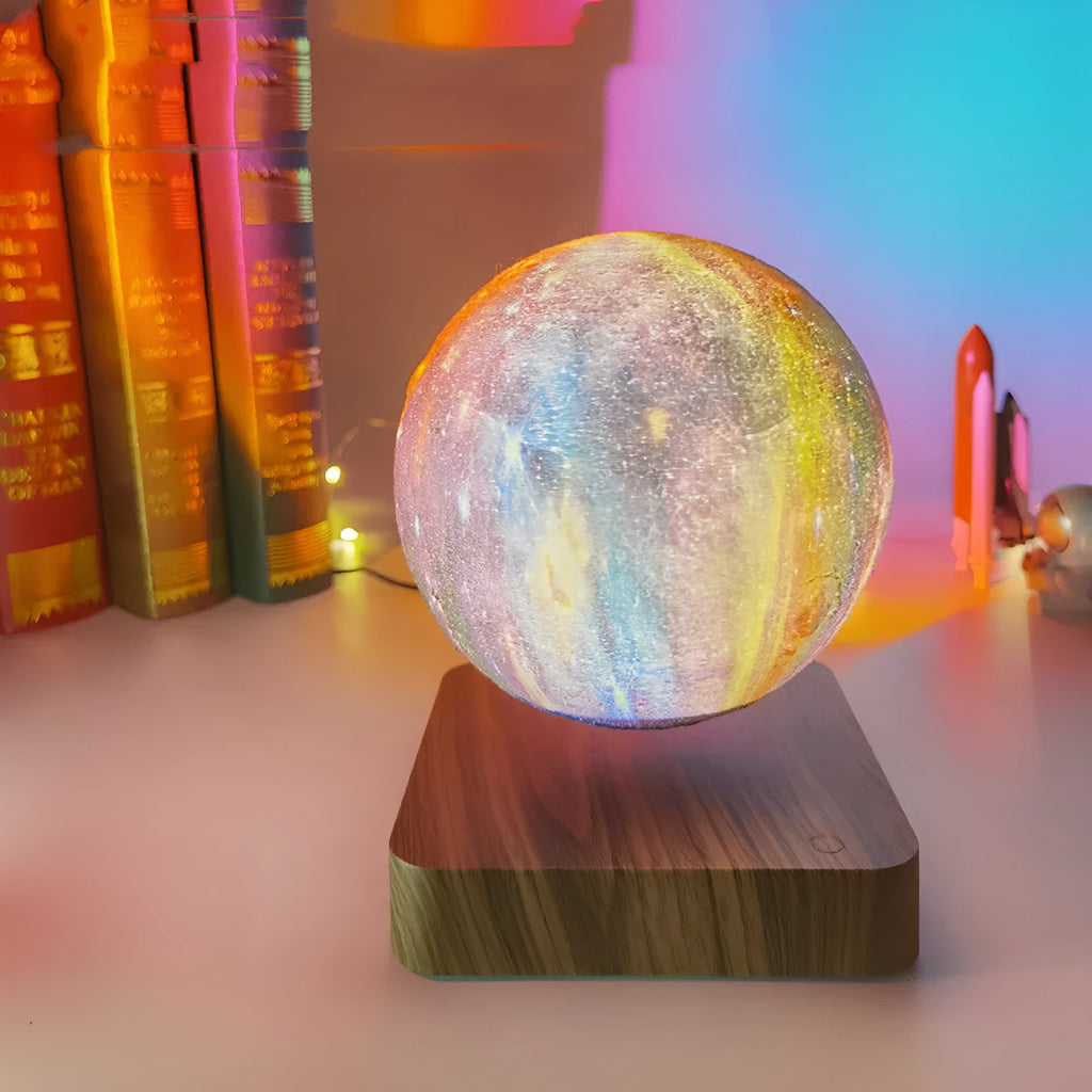 Magnetic levitation galaxy moon lamp floating above walnut-coloured base with starry light projection