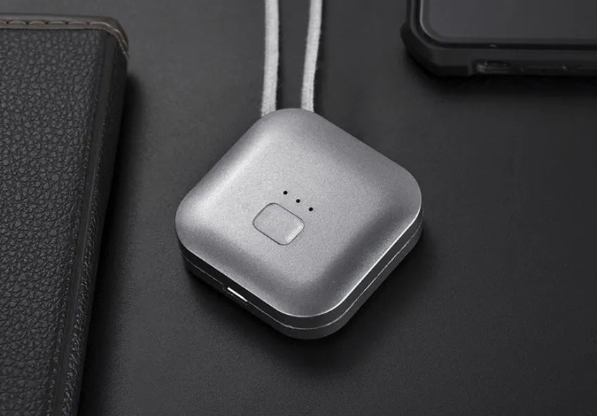 Mini USB rechargeable wearable air purifier necklace in pink, showing compact dimensions.