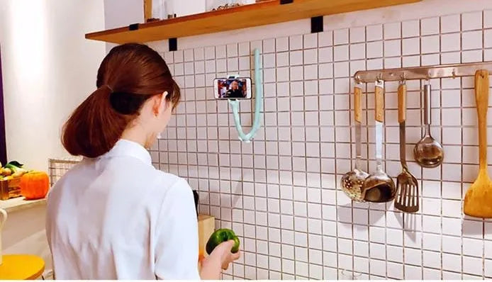 Black flexible worm arm phone holder with suction cup extended, showing 360-degree rotating bracket.