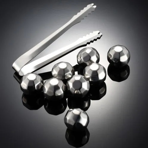 8-piece stainless steel whiskey stones set with tongs in plastic box, various shapes including squares and diamonds