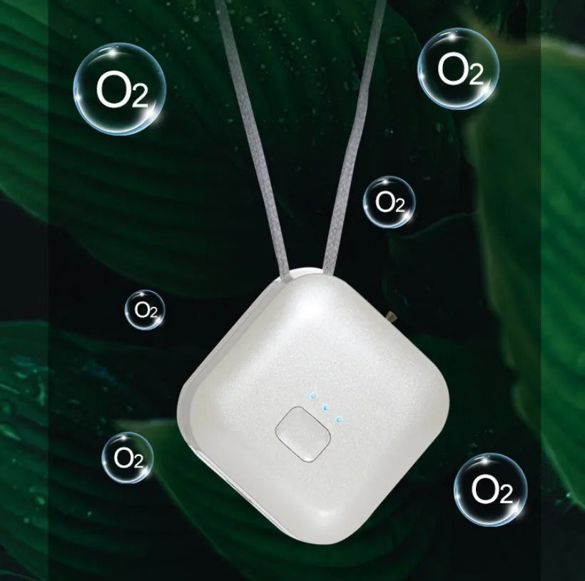 Mini USB rechargeable wearable air purifier necklace in pink, showing compact dimensions.