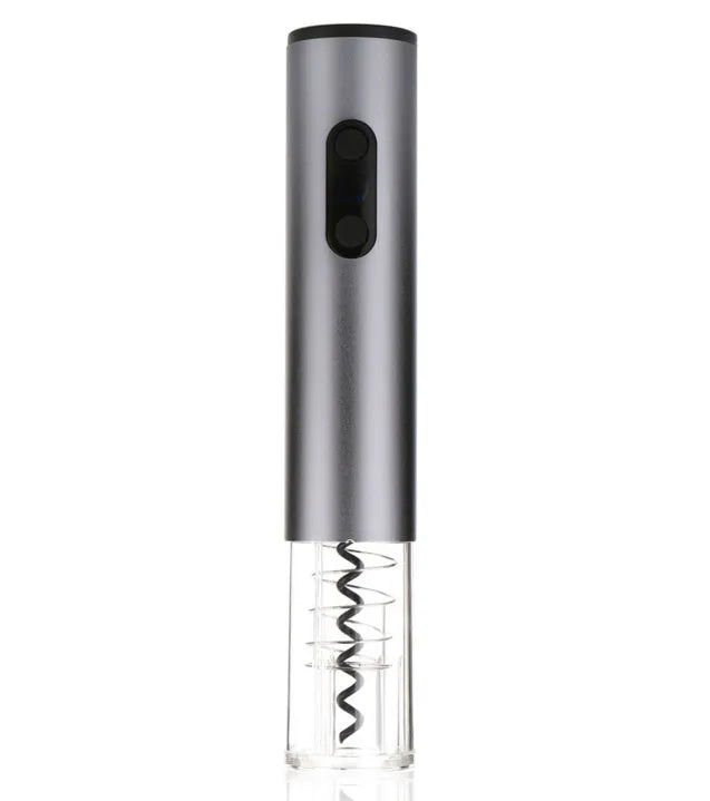 Silver automatic electric wine opener with foil cutter on a kitchen counter next to a red wine bottle