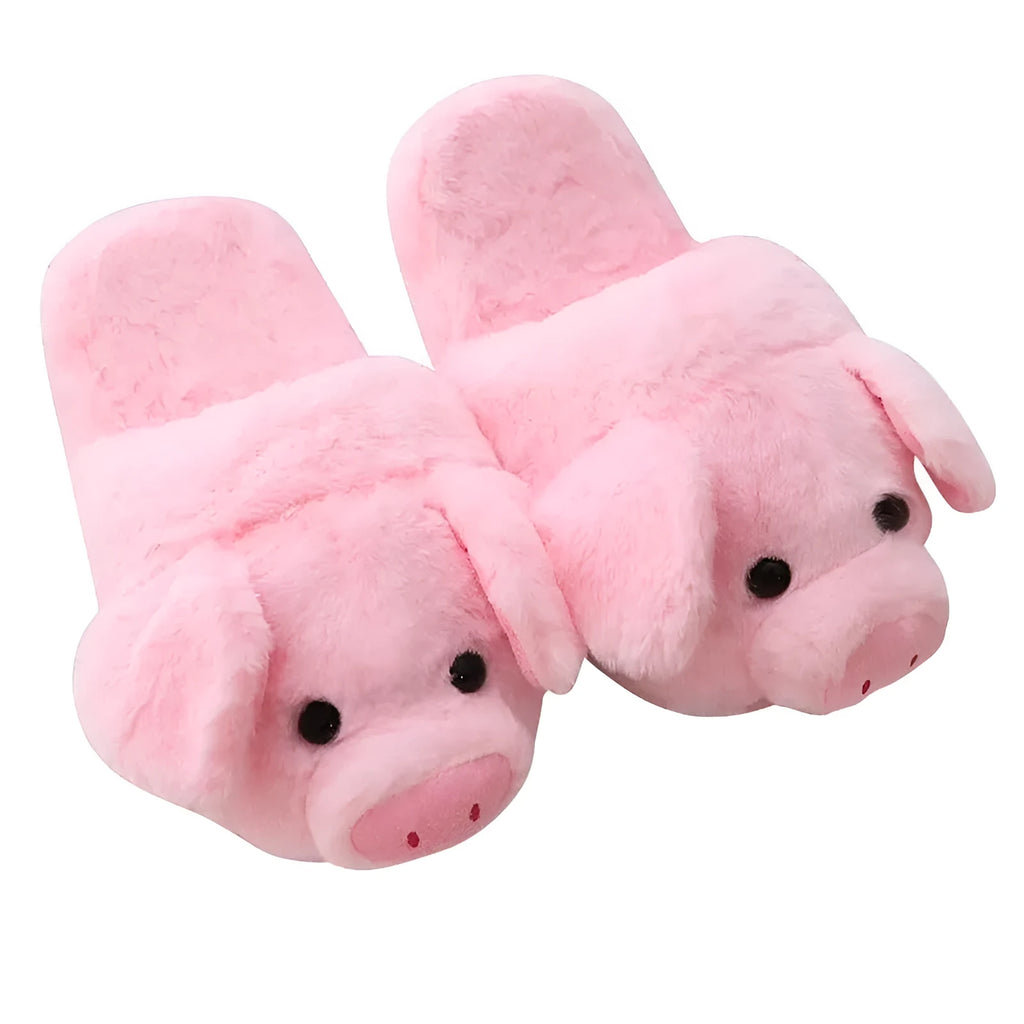 Pair of soft pink pig-shaped plush slippers with a cute animal face design.