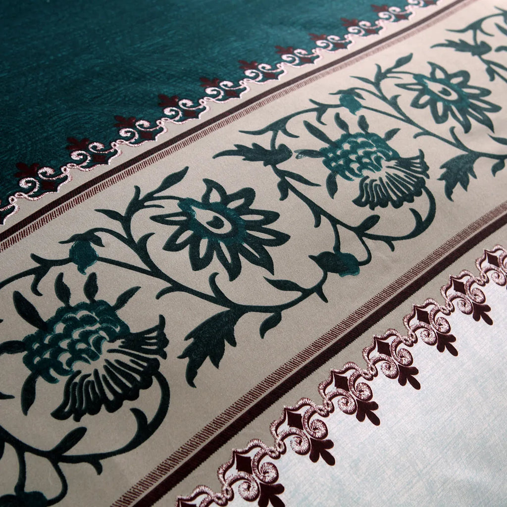 Polyester duvet cover set with plain weave reactive printing in peacock blue colour on a bed