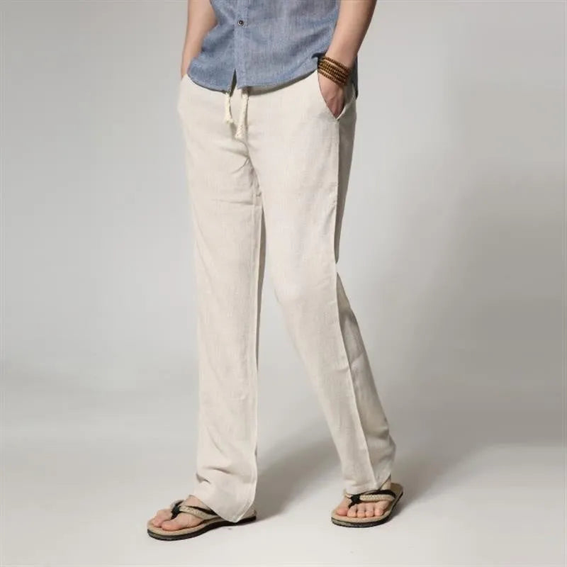 Men's loose straight cotton and linen casual pants in khaki, flat lay, showing zip fly and mid waist detail