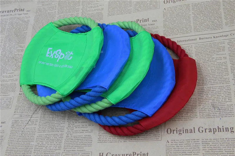 Canvas and rope dog flying disc toy 19cm diameter on grass for outdoor fetch