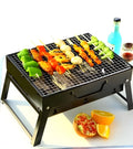 Portable folding grill rack with cold-rolled plate furnace and iron chrome grilling net, unfolded on grass