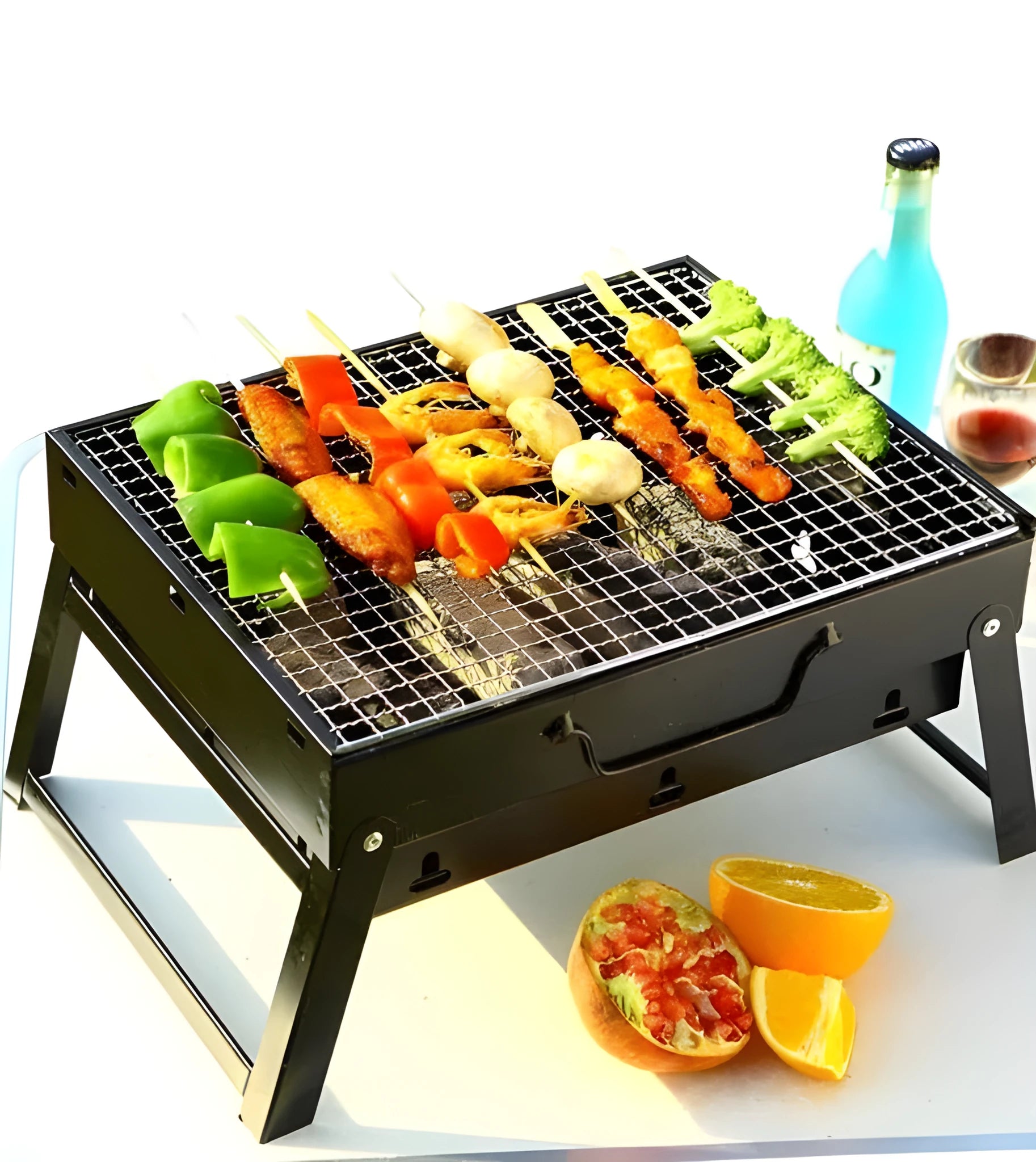 Portable folding grill rack with cold-rolled plate furnace and iron chrome grilling net, unfolded on grass