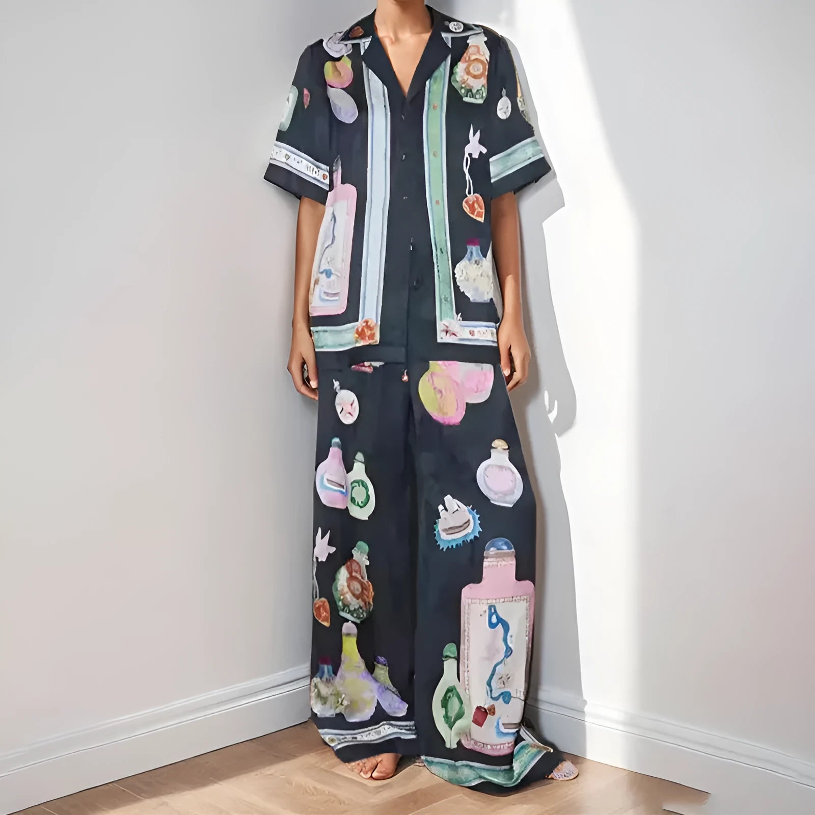 Black women's casual set with cartoon print, featuring a cardigan and trousers