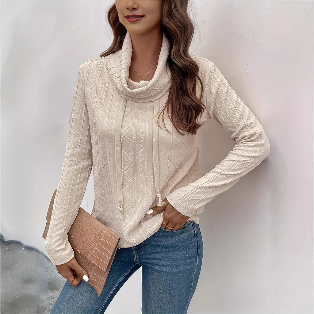 Apricot coloured women's hooded pullover sweater with long sleeves and drawstring adjustment