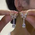 Platinum-coloured bow stud earrings made from zinc alloy with electroplated finish