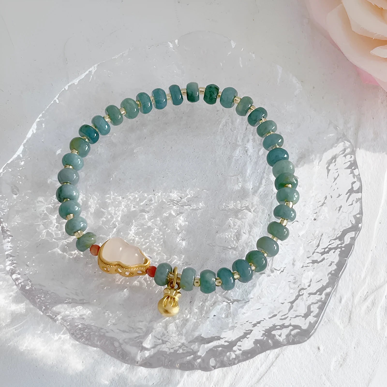 Natural blue water jade bead bracelet with gourd peace buckle design on white background