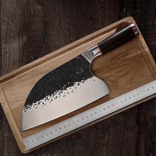 5CR15MOV stainless steel kitchen knife with ebony wood handle on cutting board for meat and bone slicing