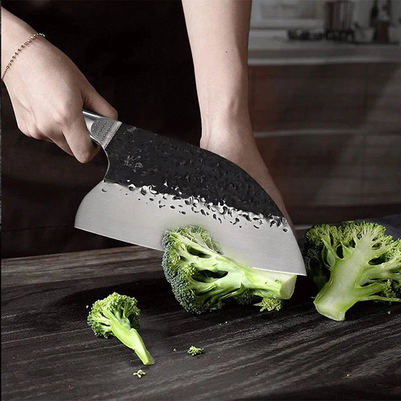 5CR15MOV stainless steel kitchen knife with ebony wood handle on cutting board for meat and bone slicing