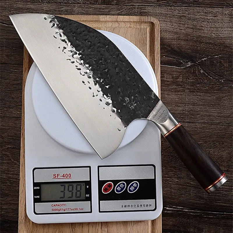 5CR15MOV stainless steel kitchen knife with ebony wood handle on cutting board for meat and bone slicing