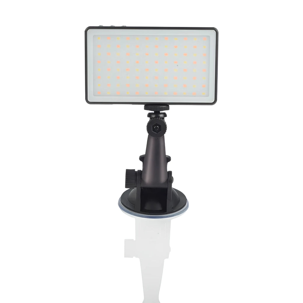Black aluminium alloy portable LED ring light for laptop video conferencing on a desk.