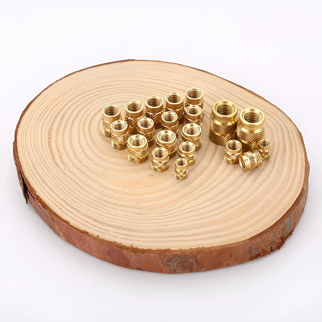 Brass M2 and M3 hot melt copper nuts with outer diameters 3.8mm 4.0mm and 4.2mm on a white background