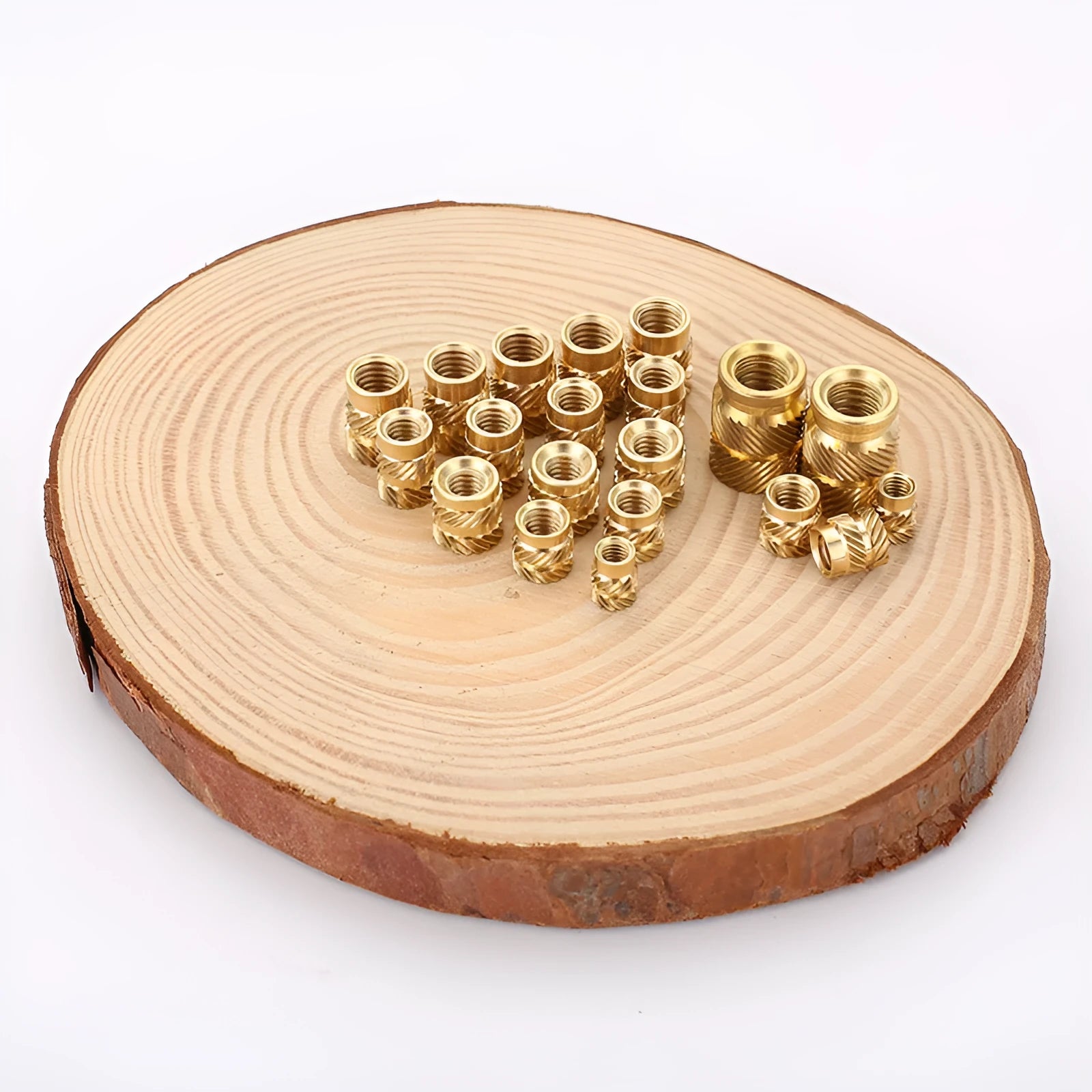 Brass M2 and M3 hot melt copper nuts with outer diameters 3.8mm 4.0mm and 4.2mm on a white background