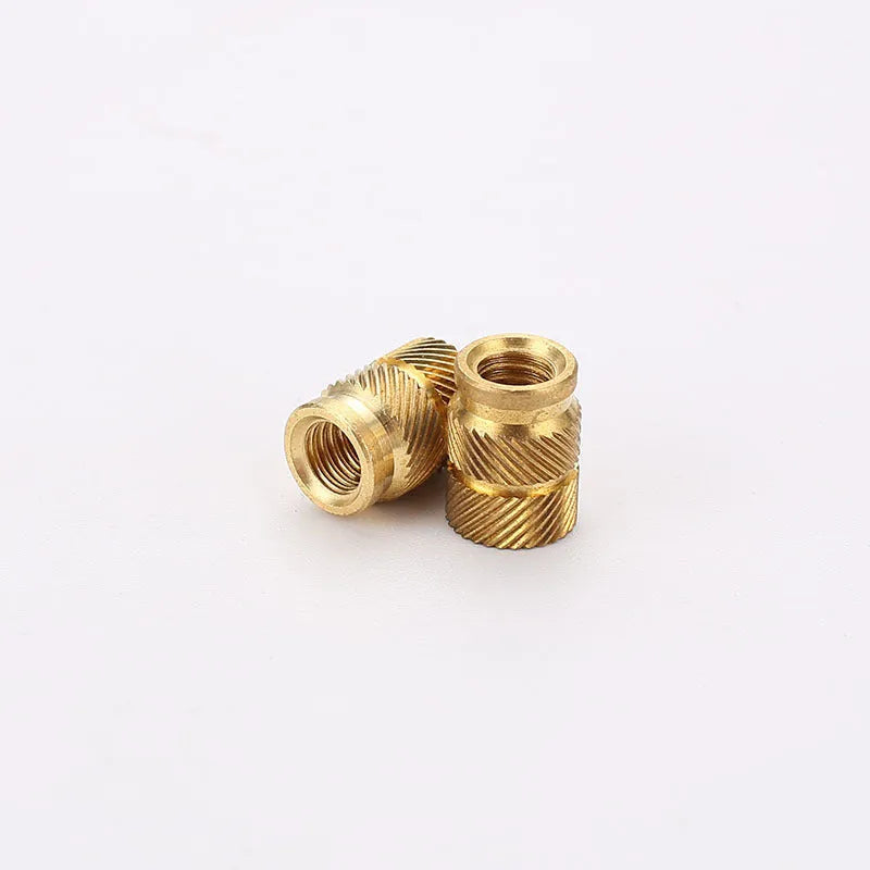 Brass M2 and M3 hot melt copper nuts with outer diameters 3.8mm 4.0mm and 4.2mm on a white background