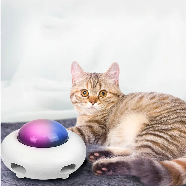 White UFO-shaped electric cat turntable toy with vibration activation and feather accessory