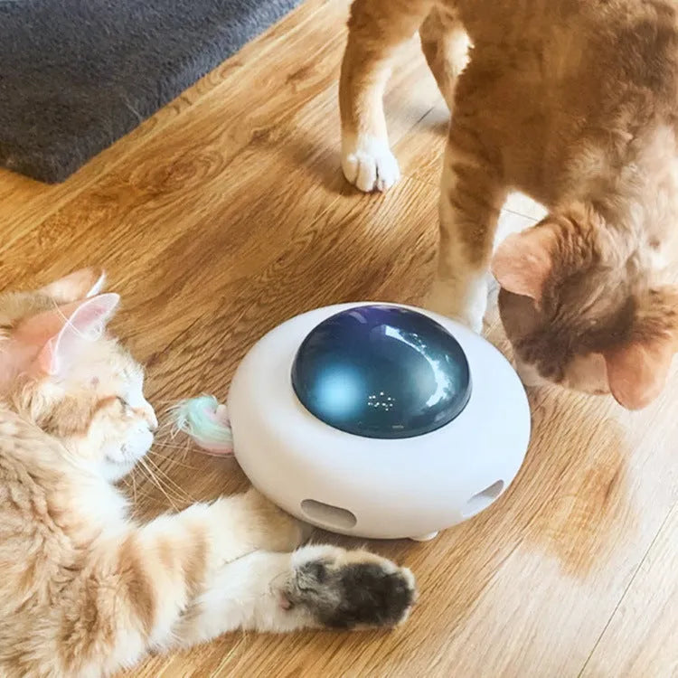 White UFO-shaped electric cat turntable toy with vibration activation and feather accessory