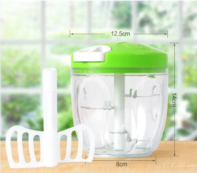 Green manual food chopper with three stainless steel blades, 500ml capacity, on a light background