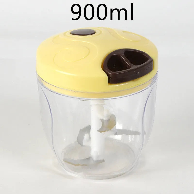 Green manual food chopper with three stainless steel blades, 500ml capacity, on a light background