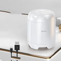 Black and white wireless Bluetooth speaker with SD card slot measuring 90x73x73mm