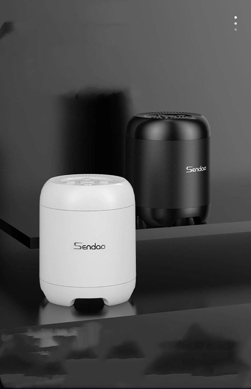 Black and white wireless Bluetooth speaker with SD card slot measuring 90x73x73mm