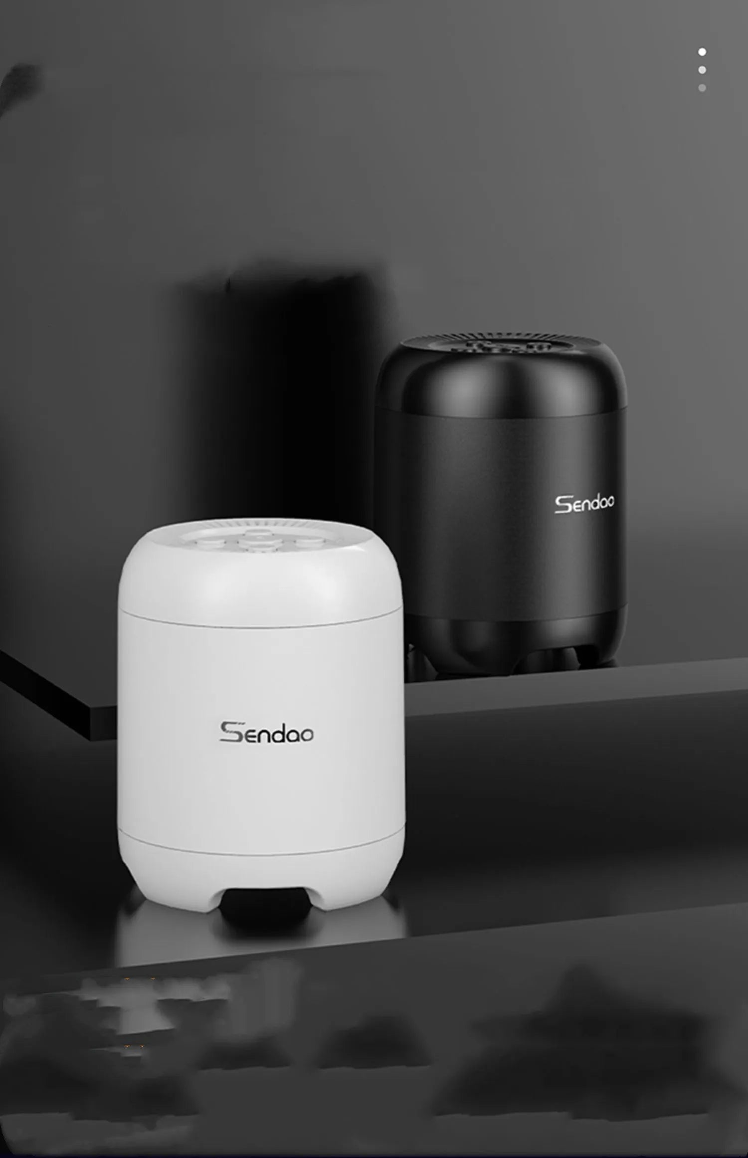 Black and white wireless Bluetooth speaker with SD card slot measuring 90x73x73mm