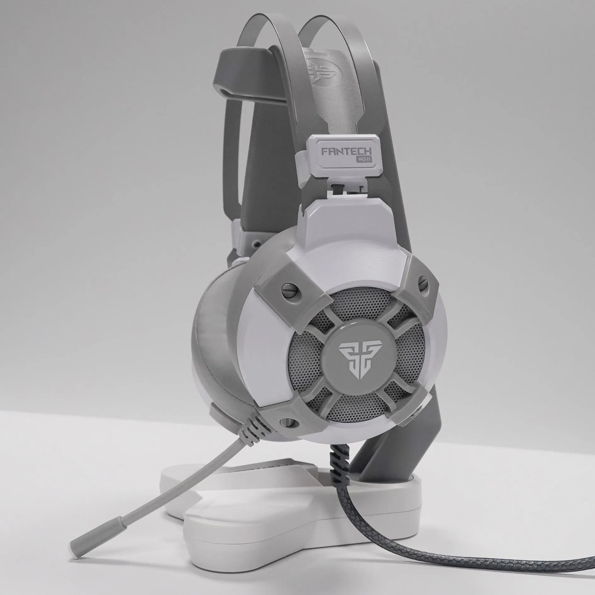 Black FANTECH HG11 USB gaming headset with large ear cups and an inline remote control on the cable.